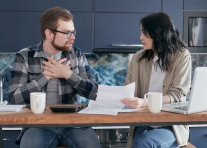 A couple discuss research about high-risk insurance.