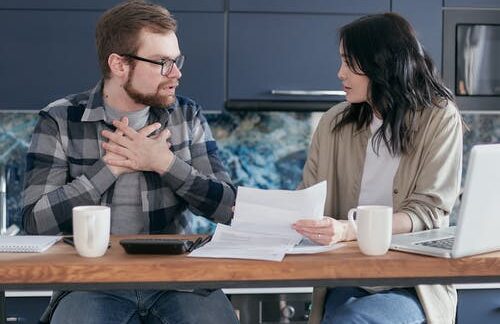 A couple discuss research about high-risk insurance.