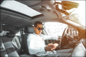 A man using his phone while driving