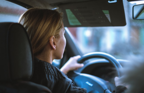 A woman driving a car.