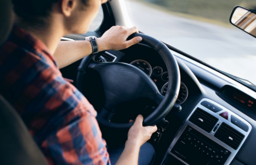 A man driving a car.