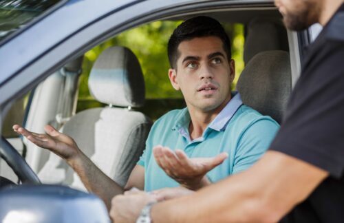 Young man stopped by officer for DUI.