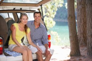 Two people sitting in back of an SUV