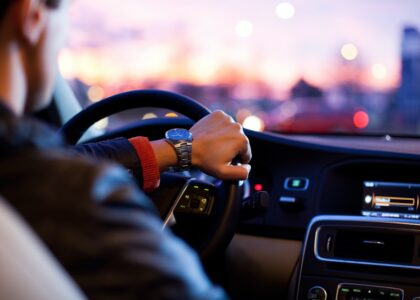 A man with high-risk auto insurance in Oregon driving a car.