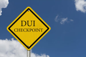 A yellow DUI checkpoint sign in Kansas.