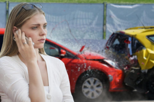 A woman who needs to file a car insurance claim is on her cell phone after having an accident.