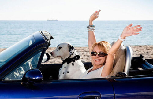 A happy driver can make monthly payments on her Florida non-owner FR-44 insurance.