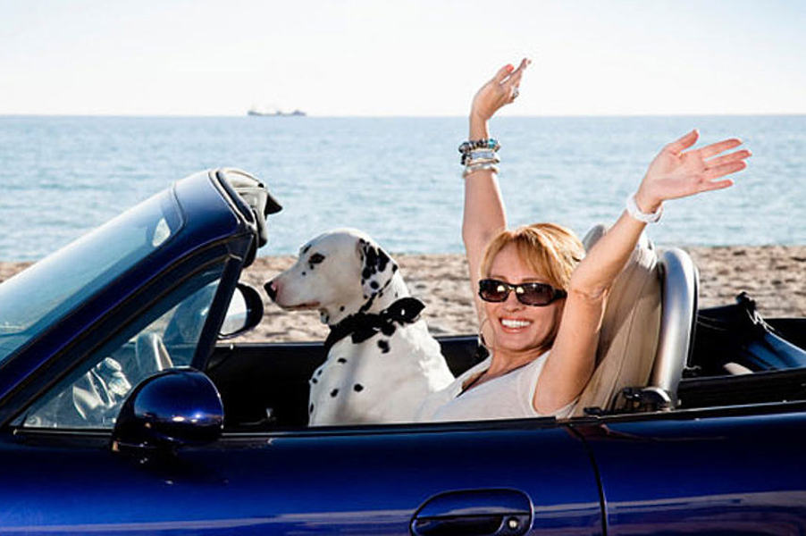 A happy driver can make monthly payments on her Florida non-owner FR-44 insurance.