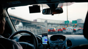 A Missouri driver using a hands-free device to use their cell phone while driving.