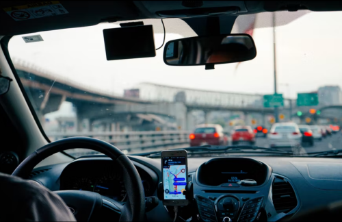 A Missouri driver using a hands-free device to use their cell phone while driving.