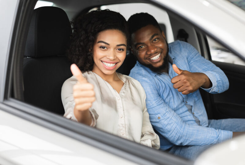 A happy driver with non-owner auto insurance protection.