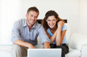 A couple looking online for non-owner auto insurance.