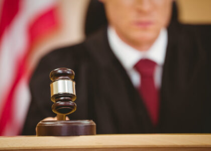 Judge in courtroom with gavel, symbolizing legal proceedings related to DUI penalties in Florida.